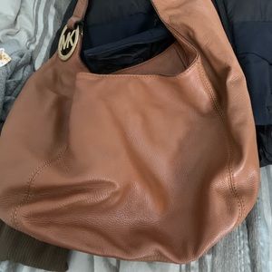 Michael Kors bags all in luggage color, tote, crossbody, wristlet. A set.